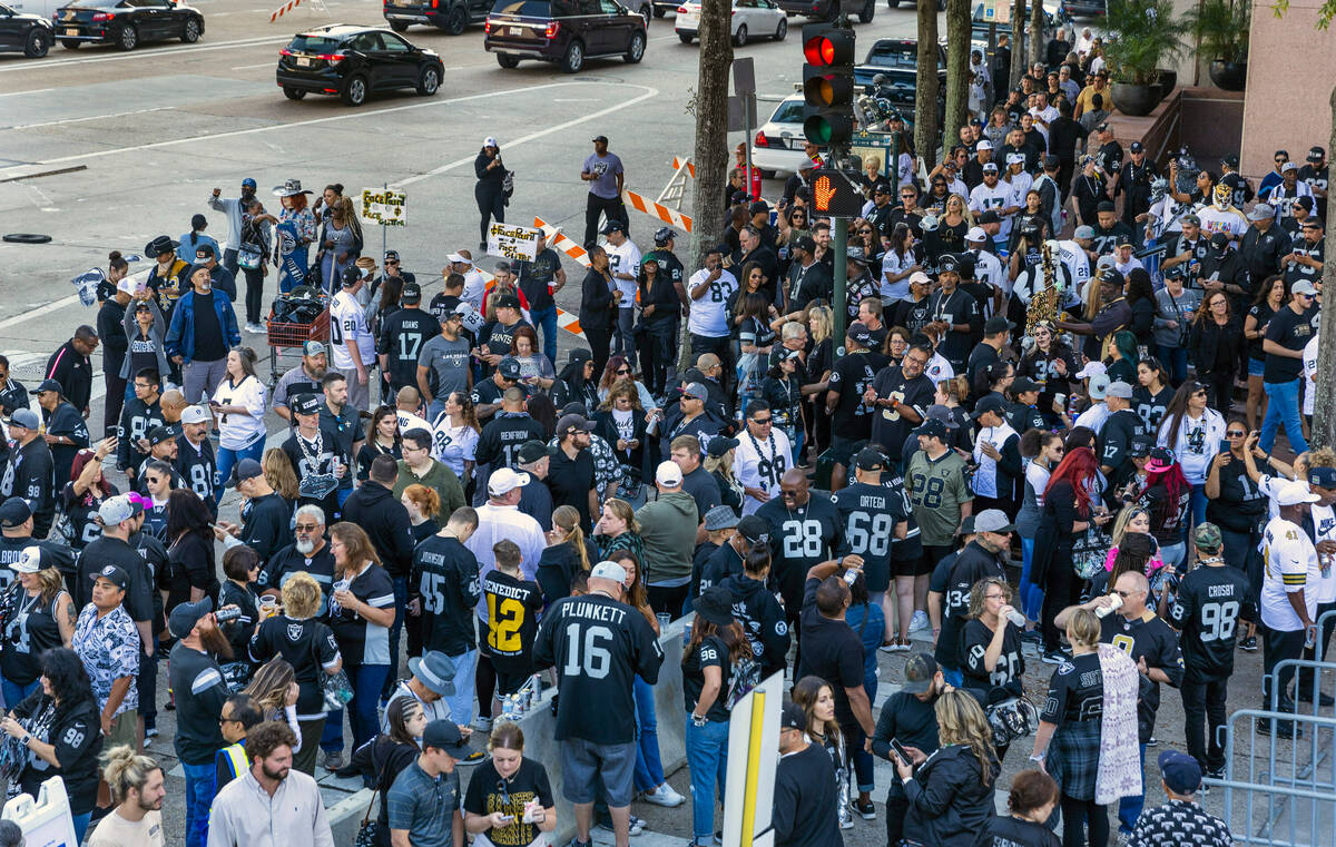 Raiders and New Orleans Saints fans gather outside before the first half of their NFL game at t ...