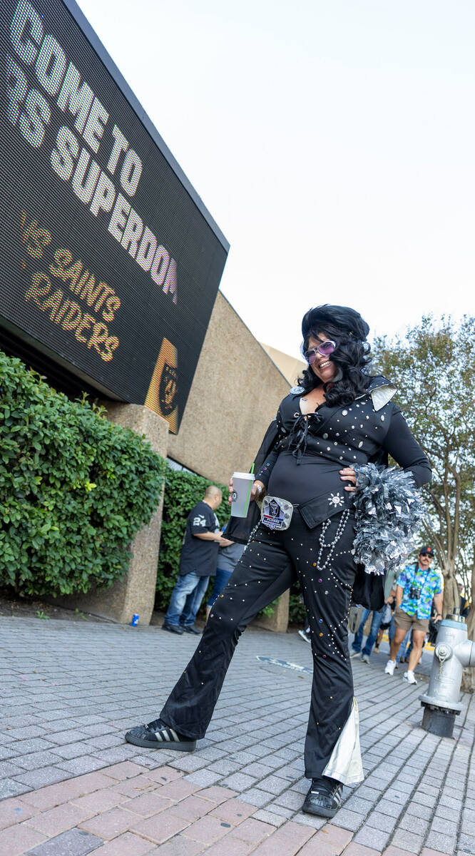 Raiders’ fan Ginger Brown poses in her Elvis costume before an NFL game between the Raid ...