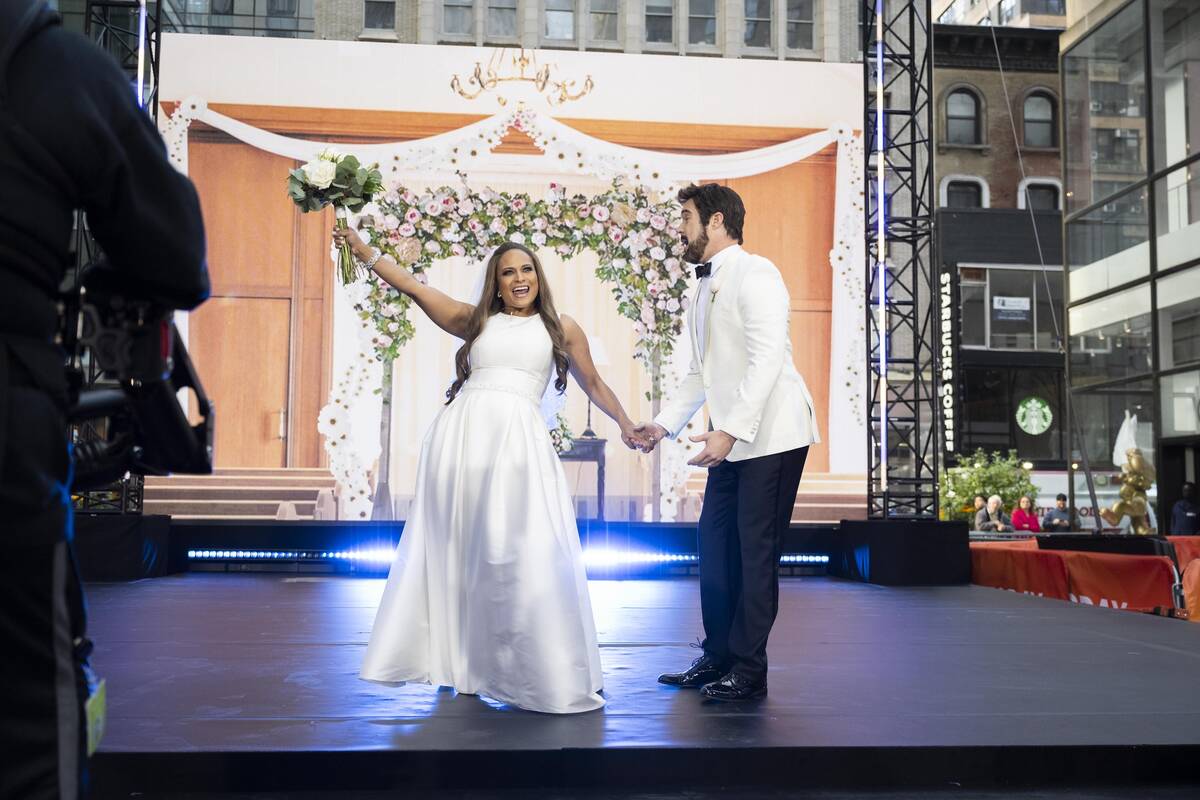 Peter Alexander as Ben Affleck and Kristen Welker as Jennifer Lopez are shown in a mock wedding ...
