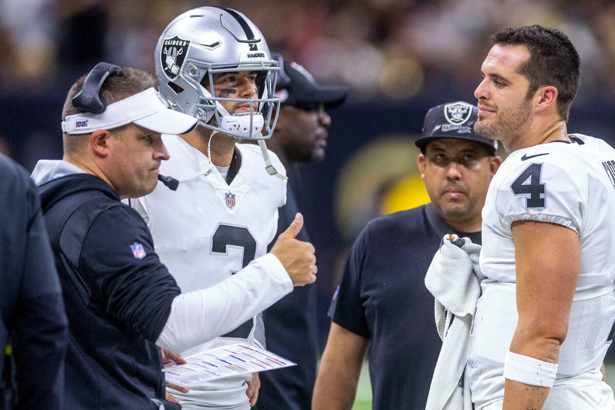 Raiders Head Coach Josh McDaniels with quarterback Jarrett Stidham (3) keeps this positive with ...