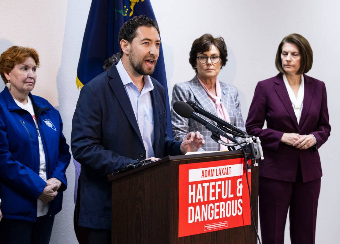 Commissioner Michael Naft speaks as U.S. Sen. Catherine Cortez Masto, right, and Sen. Jacky Ros ...