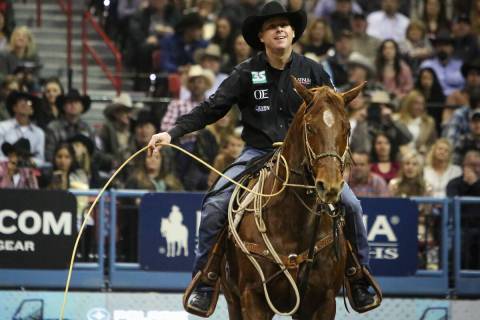 Trevor Brazile of Decatur, Texas (2) competes in tie-down roping during the tenth go-round of t ...
