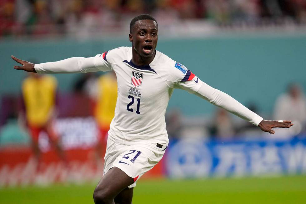 Tim Weah of the United States, celebrates after scoring during the World Cup, group B soccer ma ...