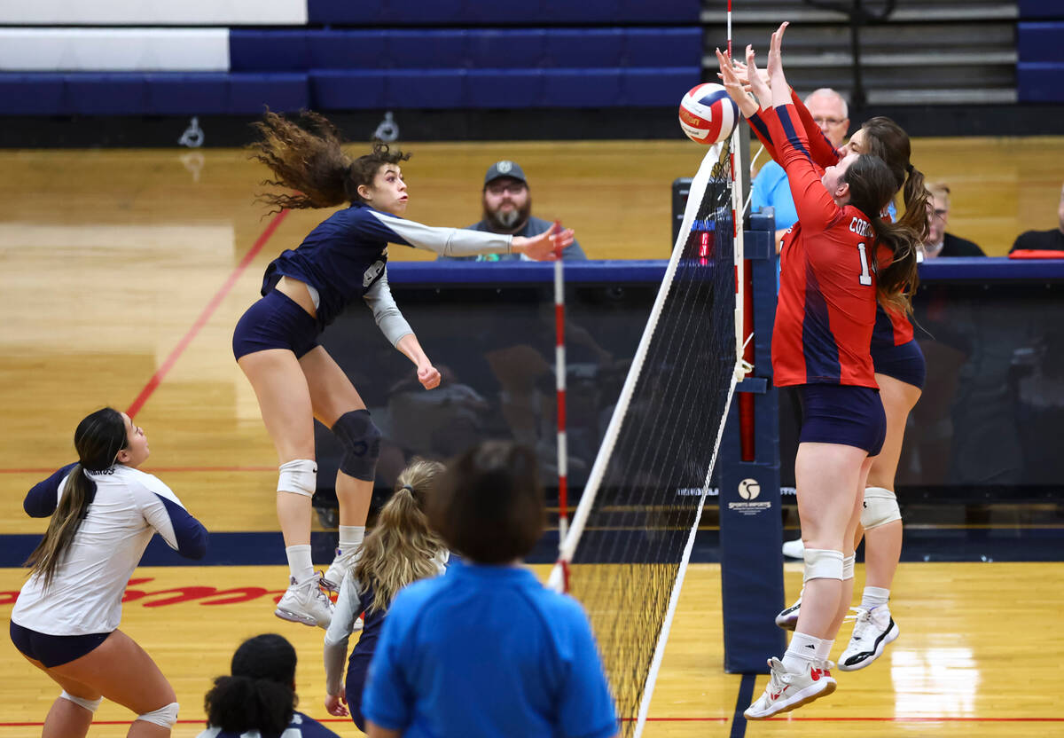 Coronado's Morgan Wale (14) and Sarah Sullivan (obscured) block a shot from Shadow Ridge's Chlo ...