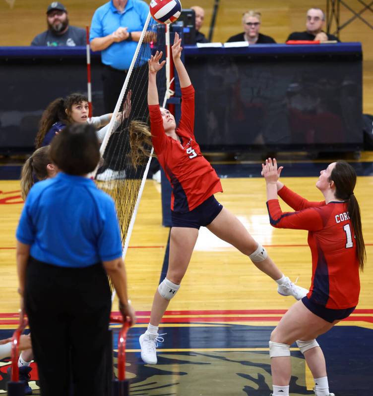 Coronado's Hannah Pemberton (5) sets the ball for Morgan Wale (14) during a volleyball game aga ...