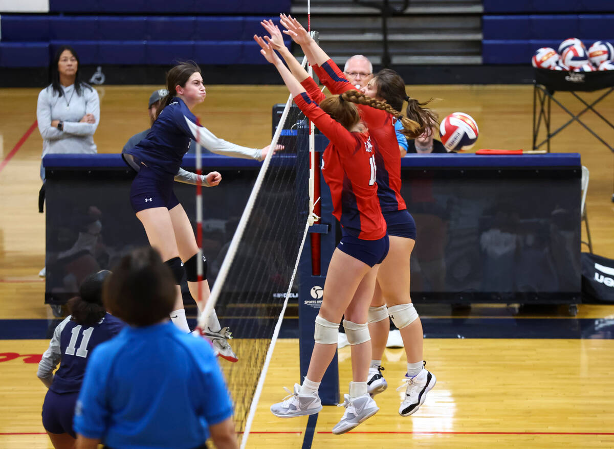 Shadow Ridge's Elaina Smith, left, sends the ball past Coronado defenders including Jaiden Pere ...