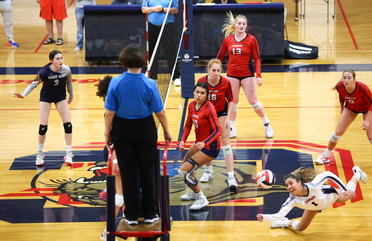 Coronado's Mia Arambula (1) dives to make a save against Shadow Ridge during a volleyball game ...