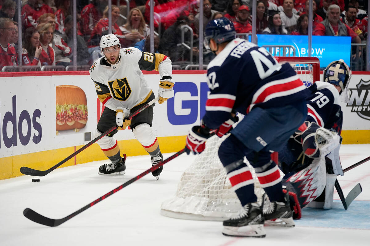 Vegas Golden Knights center Michael Amadio, left, moves the puck against Washington Capitals de ...