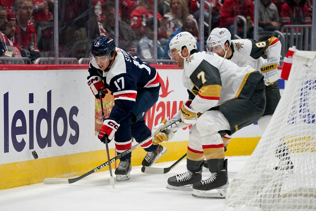 Washington Capitals center Dylan Strome, left, chases after the puck in front of Vegas Golden K ...