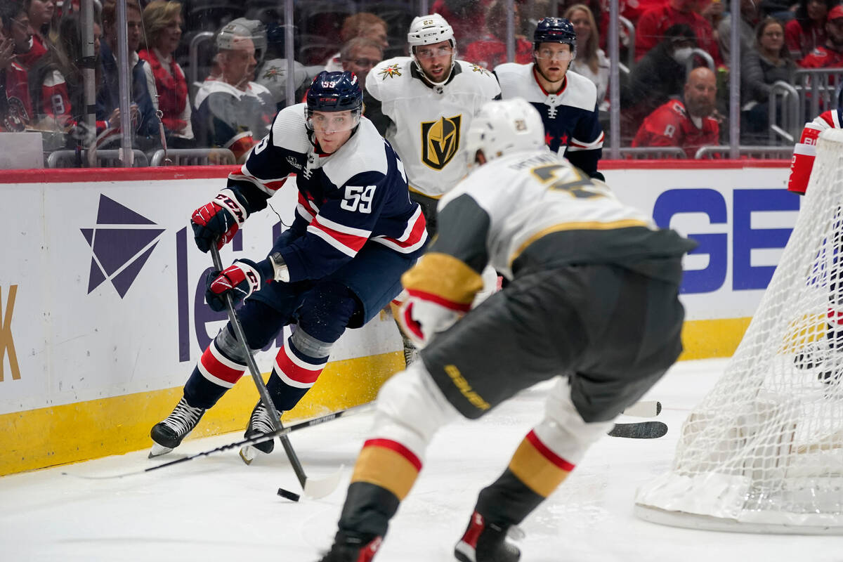 Washington Capitals center Aliaksei Protas (59) moves the puck toward Vegas Golden Knights cent ...