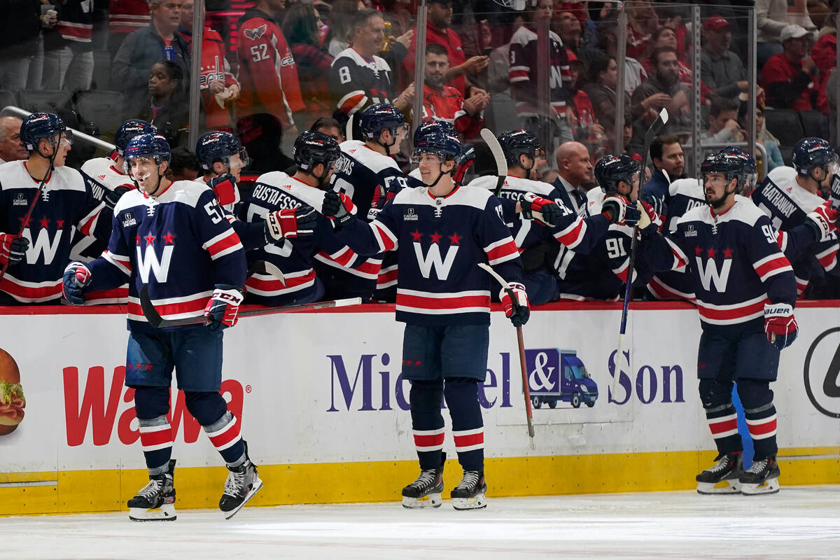 Washington Capitals' Trevor van Riemsdyk, left, celebrates his goal with teammates in the secon ...