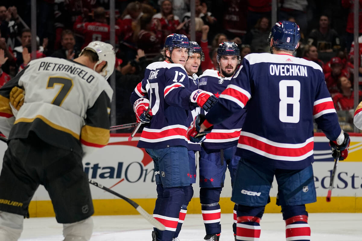 Washington Capitals' Dylan Strome (17), Evgeny Kuznetsov and Marcus Johansson celebrate Johanss ...