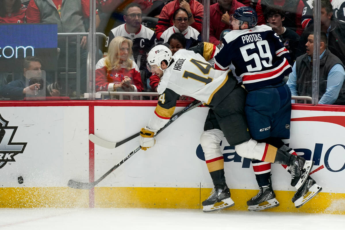 Vegas Golden Knights defenseman Nicolas Hague (14) and Washington Capitals center Aliaksei Prot ...