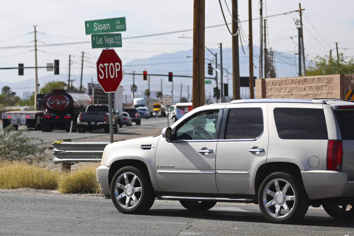 Traffic passes by the intersection of Sloan Lane at North Las Vegas Boulevard, which is slated ...