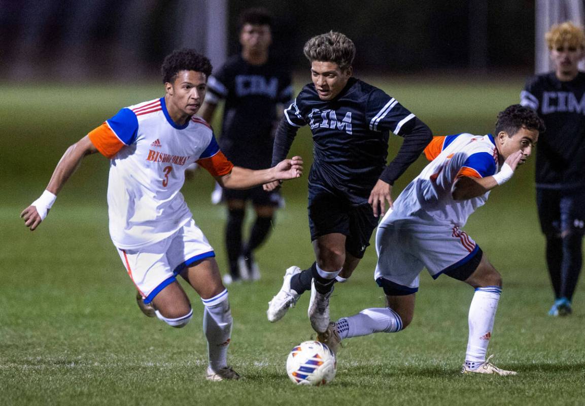 Bishop Gorman's Bronson Rolley (3) pushes away Cimarron's Jonathon Walter (8) as Bishop Gorman' ...