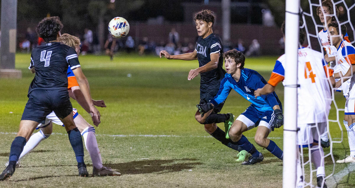 Bishop Gorman's goalie Devon Hume (24) eyes a scoring attempt by Cimarron during the first half ...