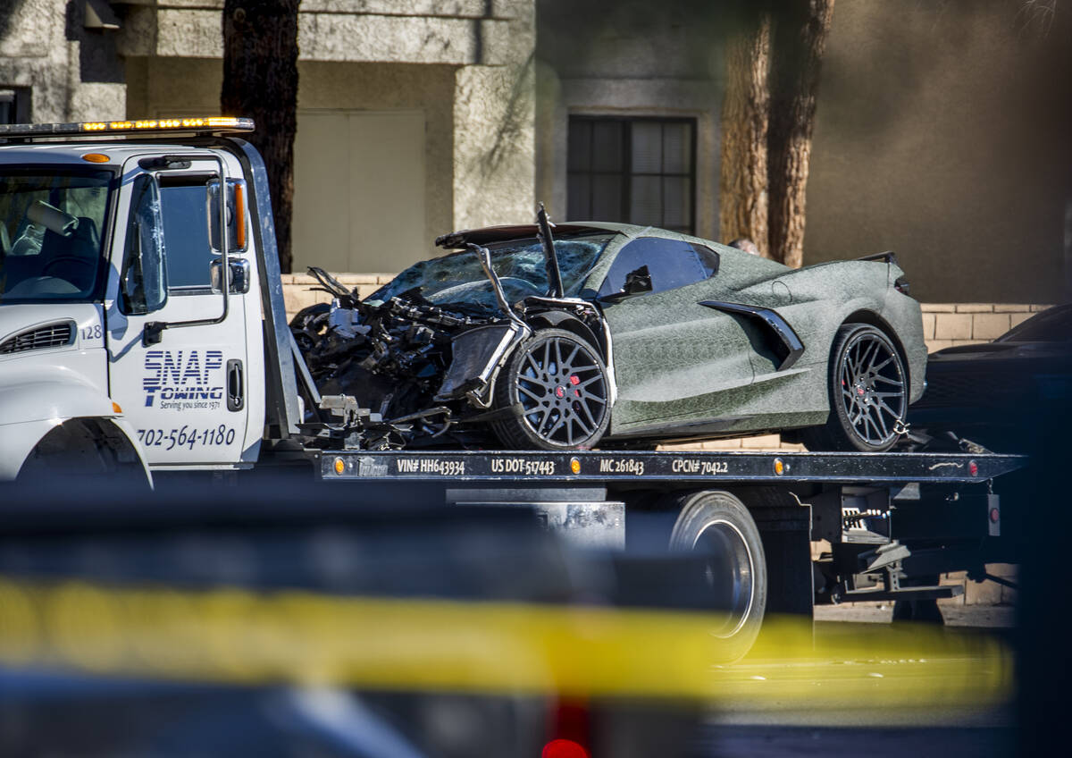 A damaged Corvette driven by Raiders wide receiver Henry Ruggs is loaded for transport after a ...