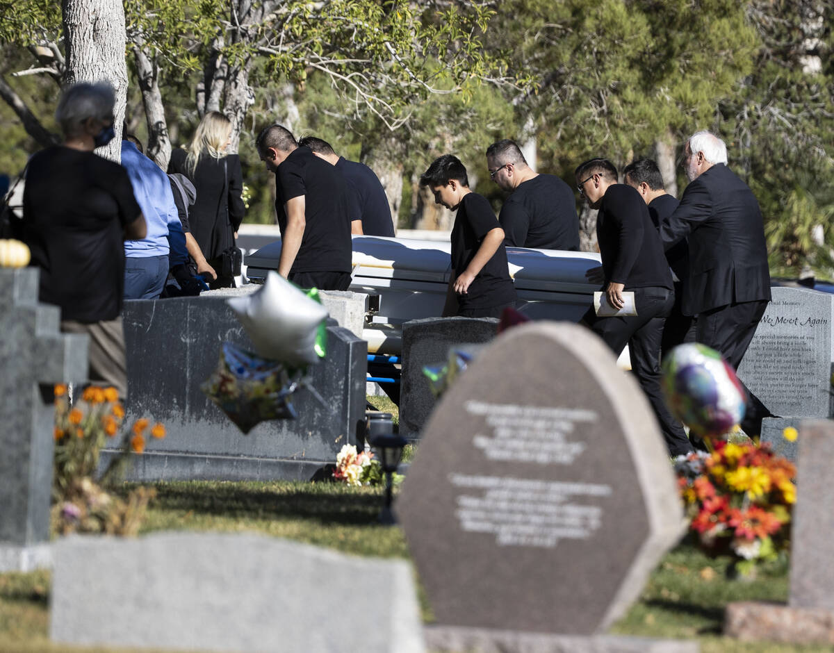 Pallbearers carry the casket of Tina Tintor, killed in a crash involving then-Raiders wide rece ...