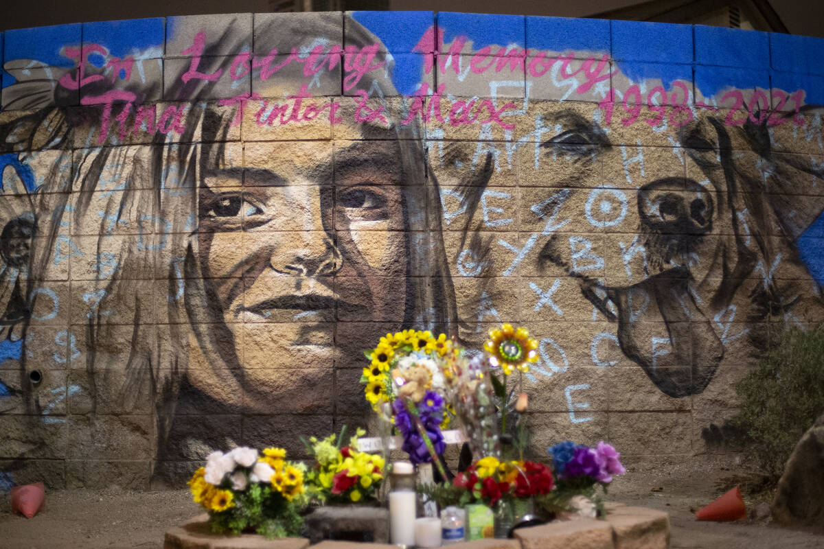 A mural of Tina Tintor and her dog, Max, who were killed in a car crash involving an NFL player ...