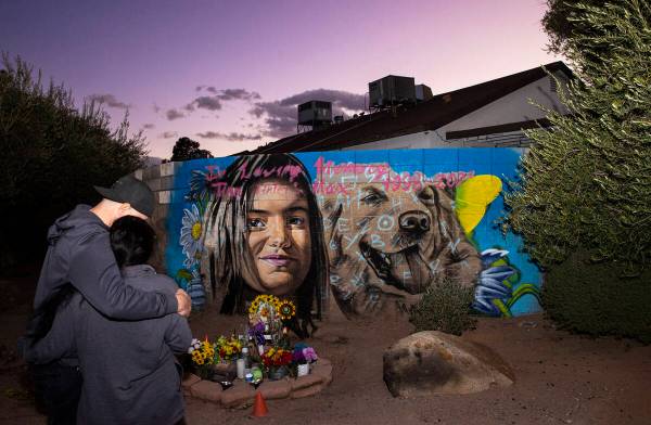 David and Jenny, who declined to give their last names, visit a mural in memory of Tina Tintor ...