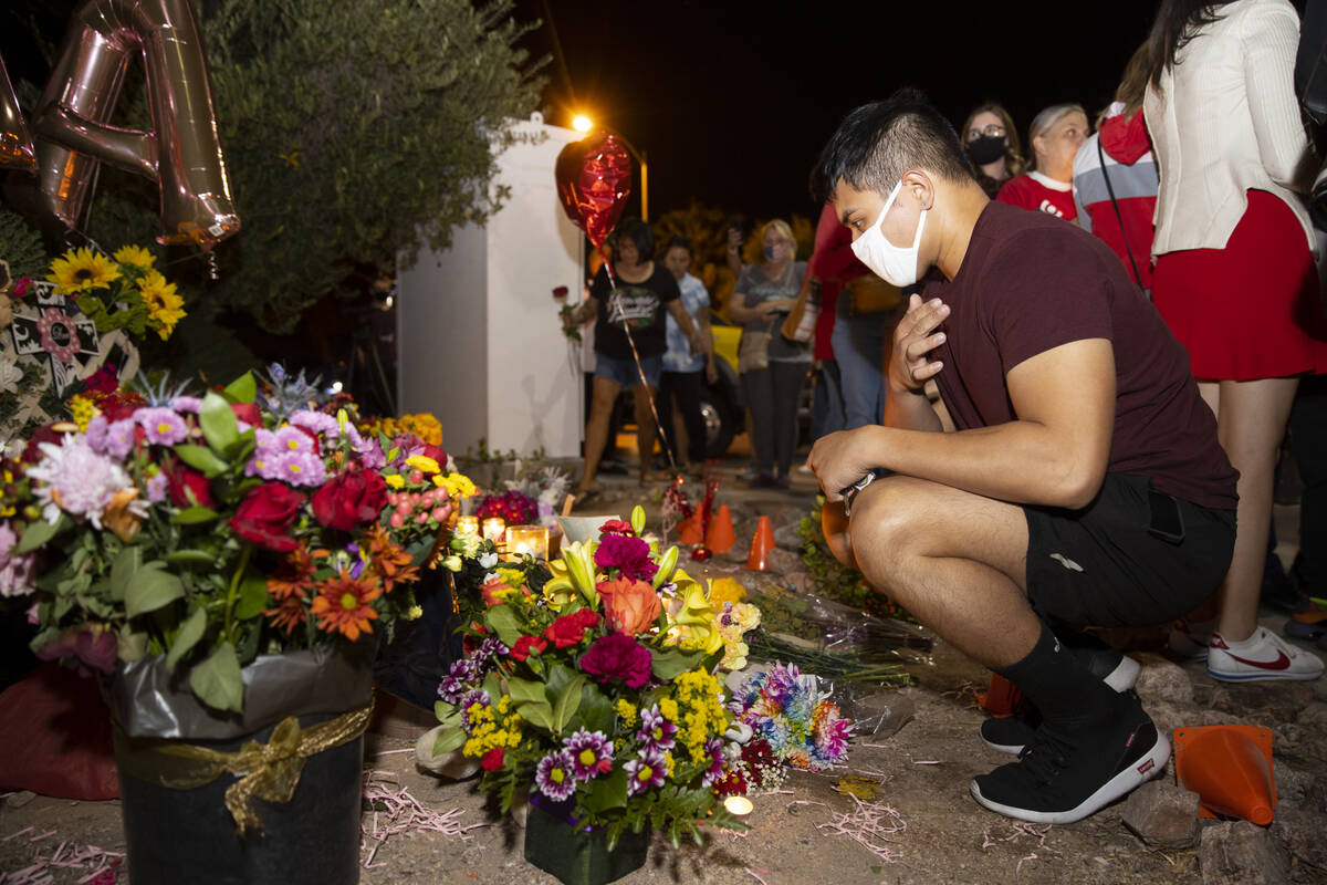 Joey Cruz attends a vigil for his co-worker Tina Tintor and her dog, Max, at a memorial on Rain ...