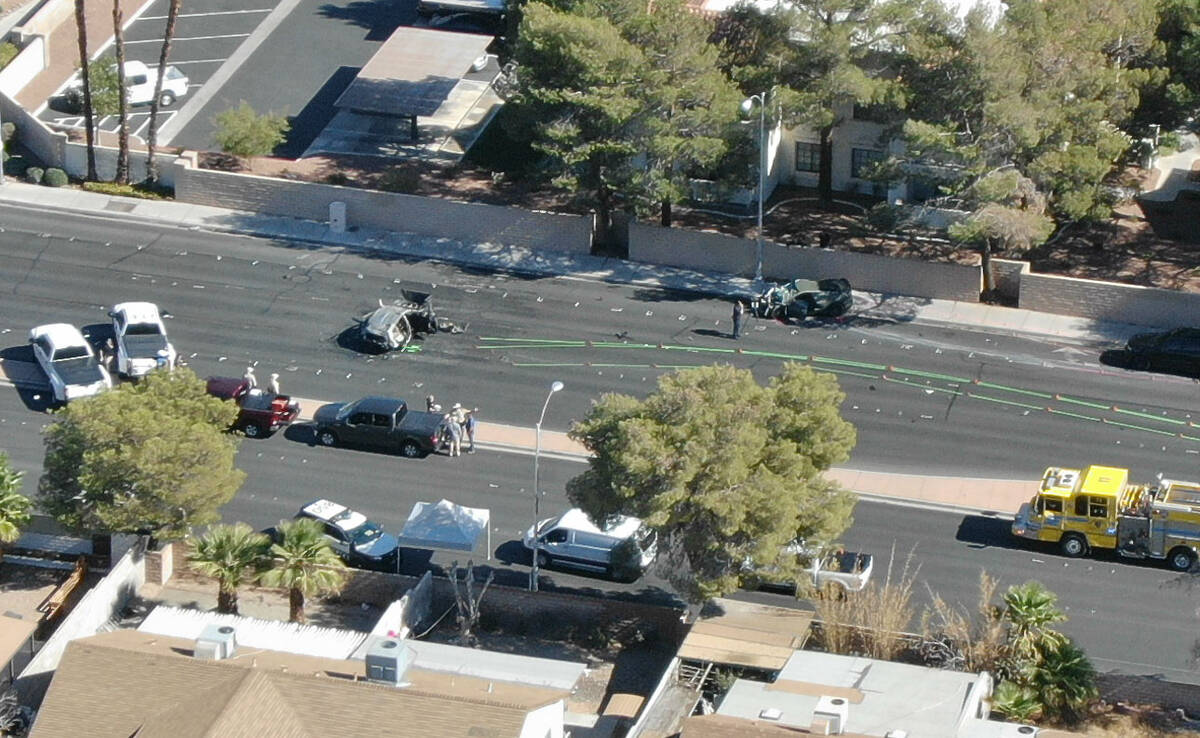 An aerial view Las Vegas police investigating a fatal crash involving two vehicles at South Rai ...
