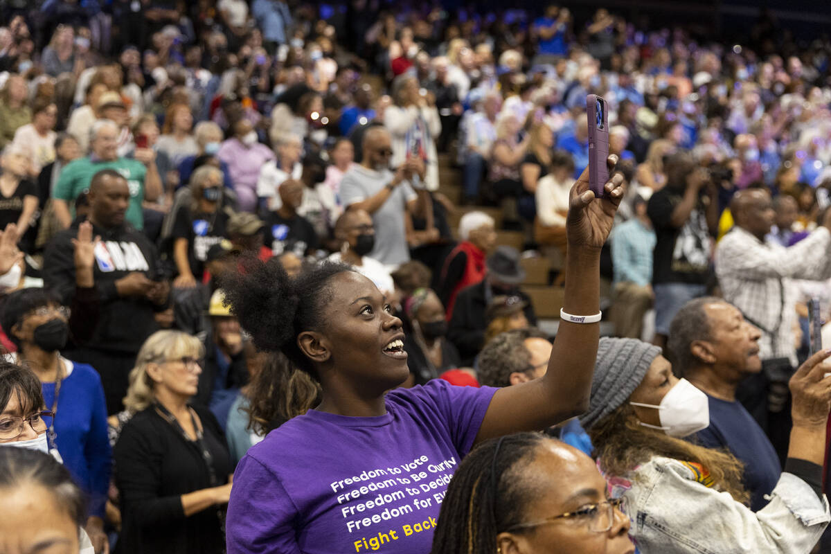 People watch musician John Legend perform during a campaign rally organized by Nevada Democrat ...