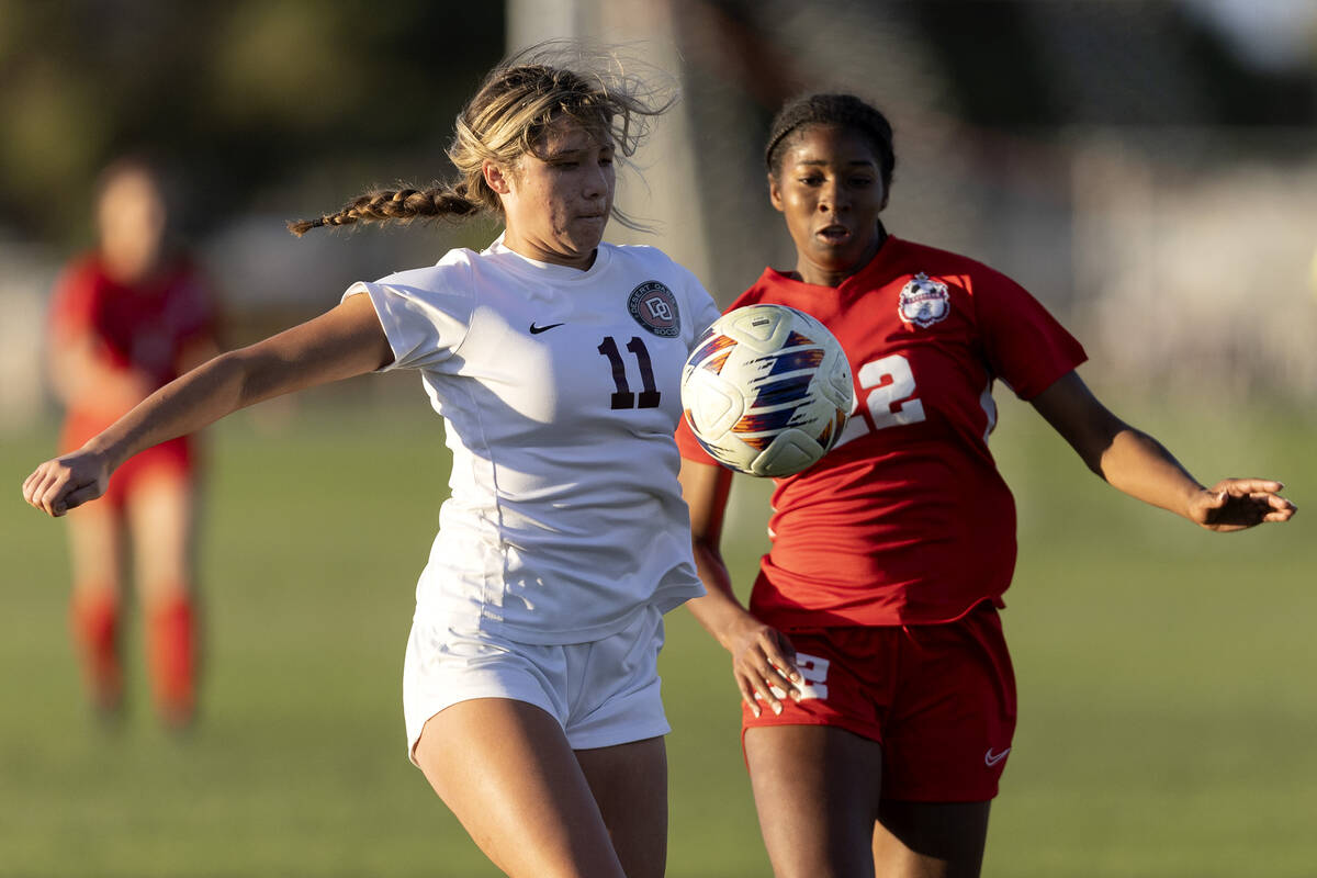 Desert Oasis’ Angelina Labrague (11) dribbles against Coronado’s Sierah McCallum ...