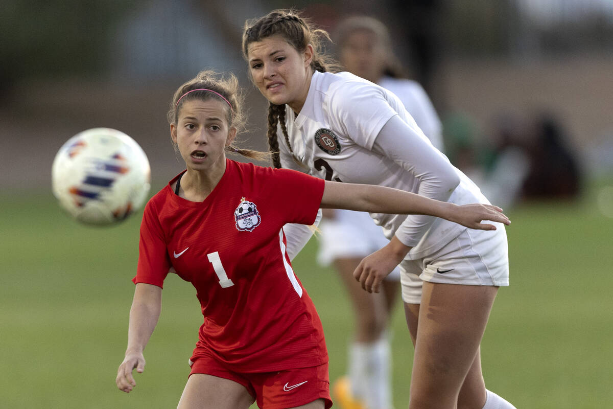 Coronado’s Lily Fama (1) and Desert Oasis’ Kate Perkes (2) watch Fama’s pa ...