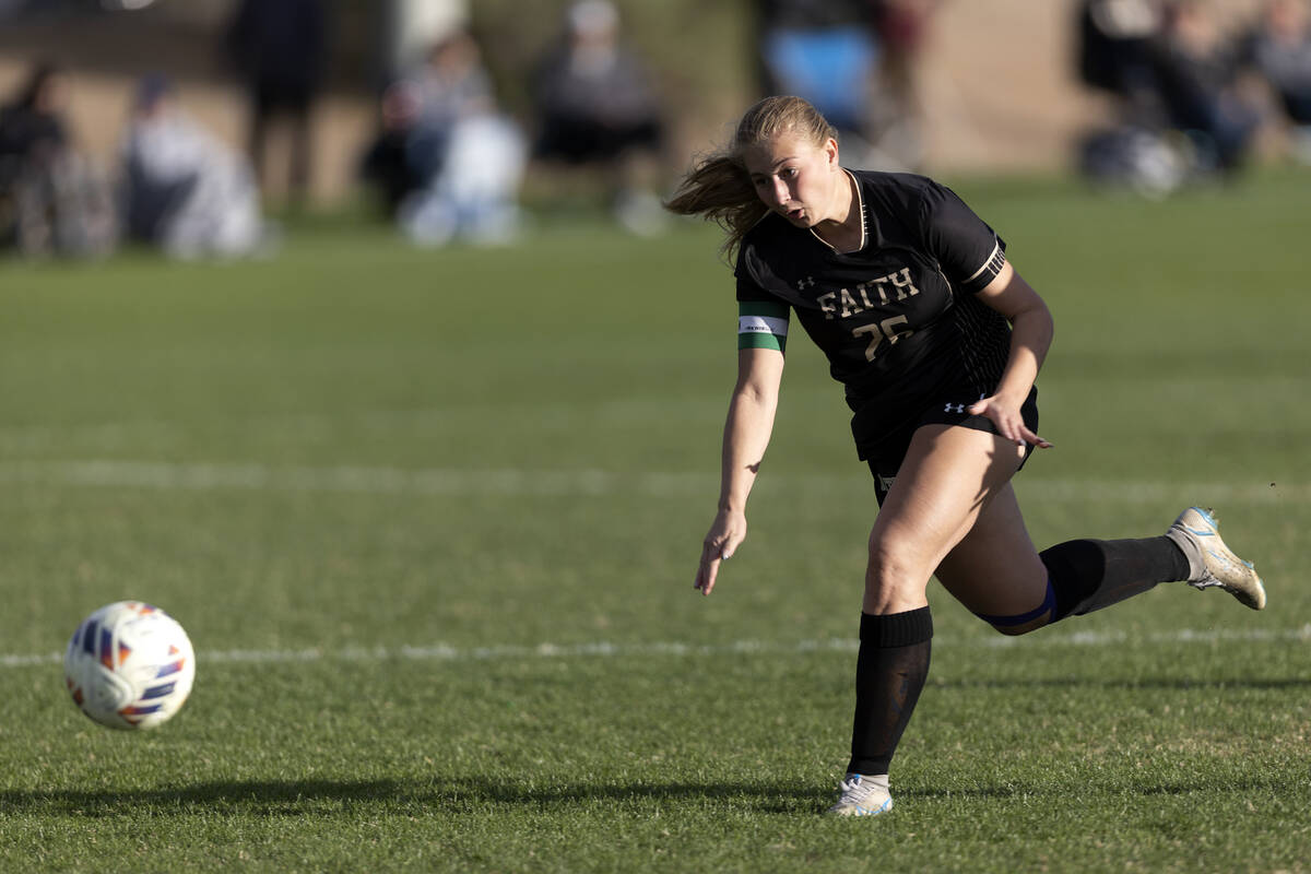 Faith Lutheran’s Taylor Folk (26) attempts a goal on Shadow Ridge during a Class 5A girl ...