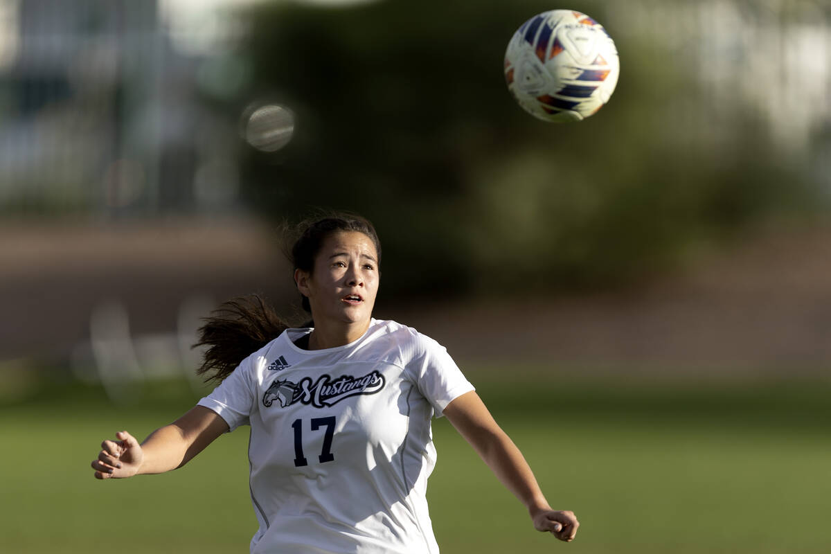 Shadow Ridge’s Trystyn Divich (17) prepares to head the ball during a Class 5A girls soc ...