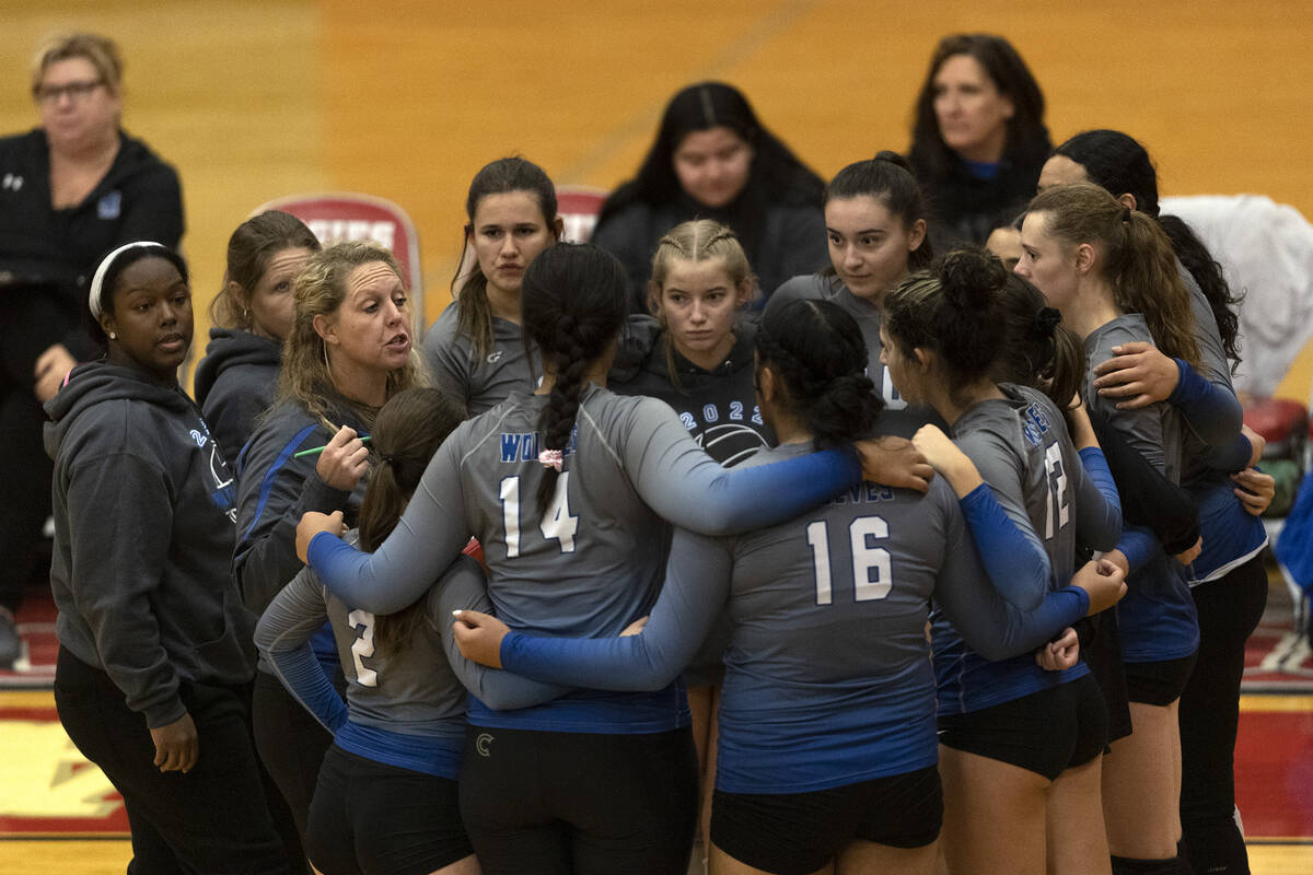 Basic gathers in a timeout as their team is losing the second set during a Class 4A girls state ...