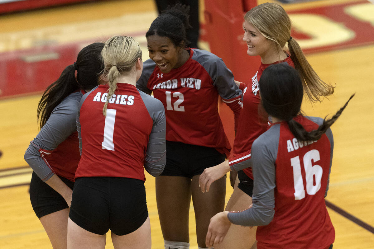 Arbor View gathers to celebrate a point scored against Basic during a Class 4A girls state voll ...