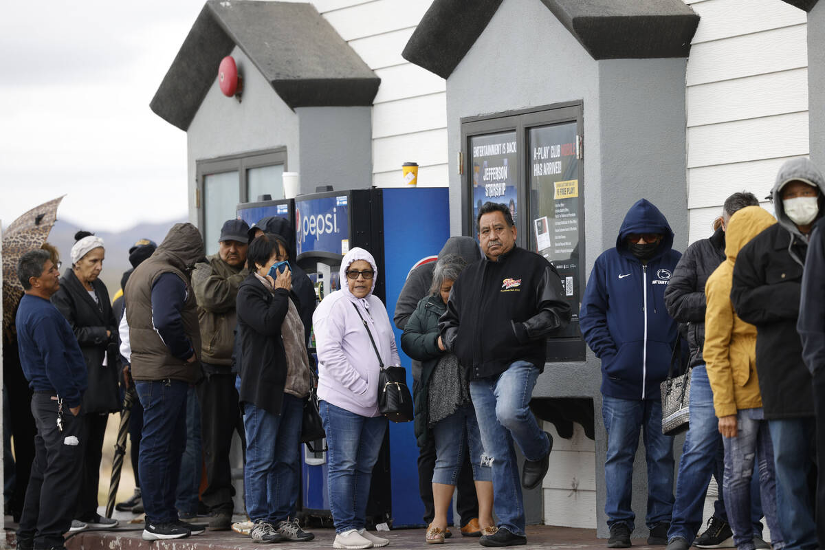 People wait in line to buy lottery tickets at the Lotto Store at Primm, just inside the Califor ...