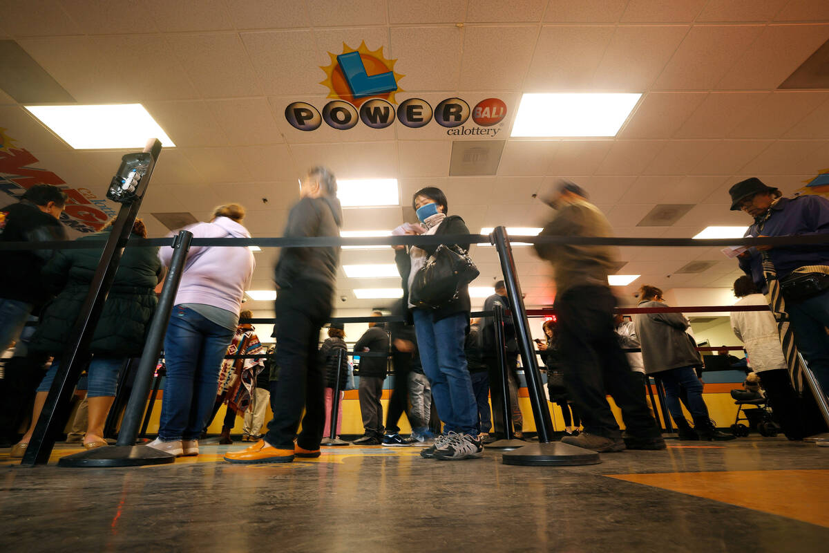 People wait in line to buy lottery tickets at the Lotto Store at Primm, just inside the Califor ...