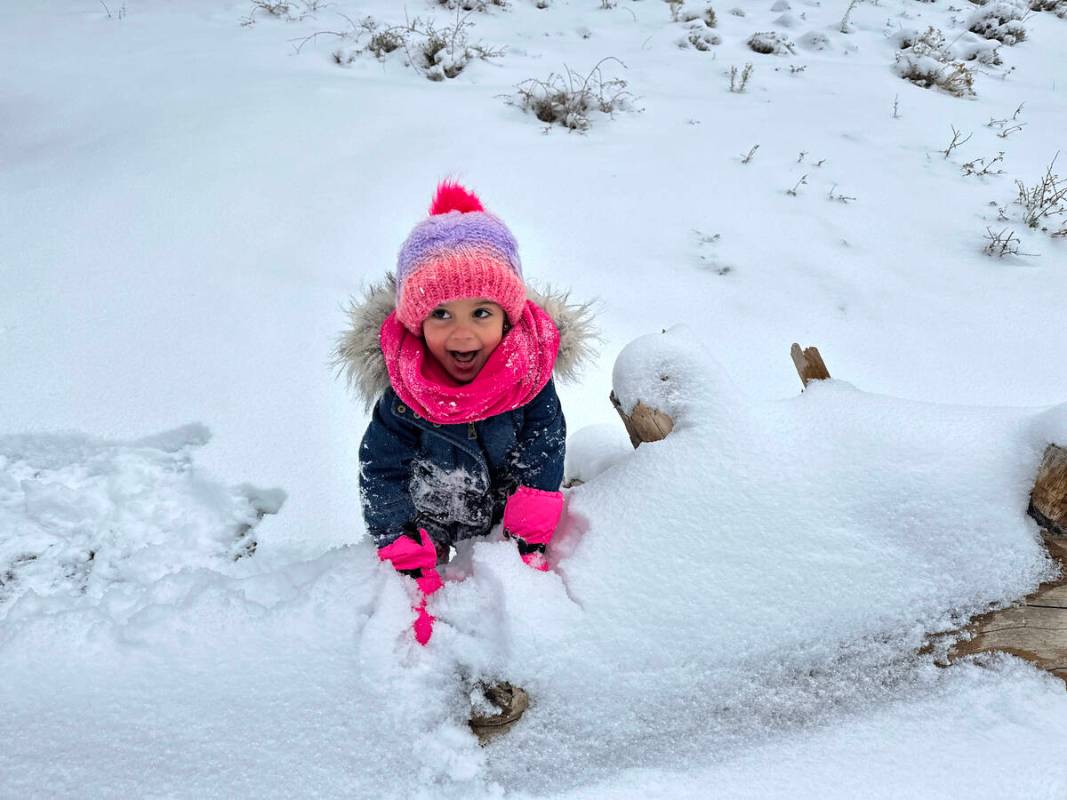 Angel Frias-Irizarry, 3, of Las Vegas plays in freshly fallen snow, in Upper Lee Meadows on Mou ...