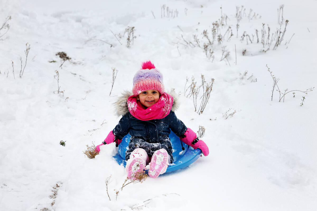 Angel Frias-Irizarry, 3, plays in freshly fallen snow in Upper Lee Meadows on Mount Charleston ...