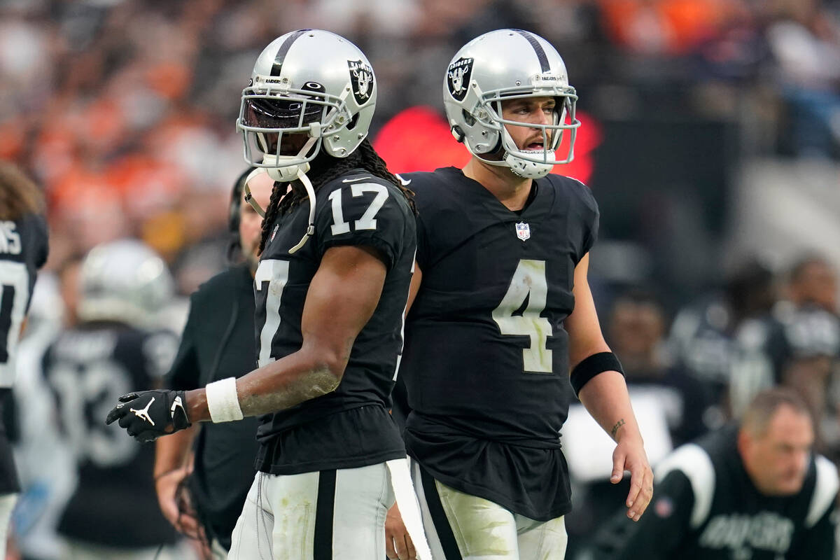 Las Vegas Raiders wide receiver Davante Adams (17), left, and Las Vegas Raiders quarterback Der ...