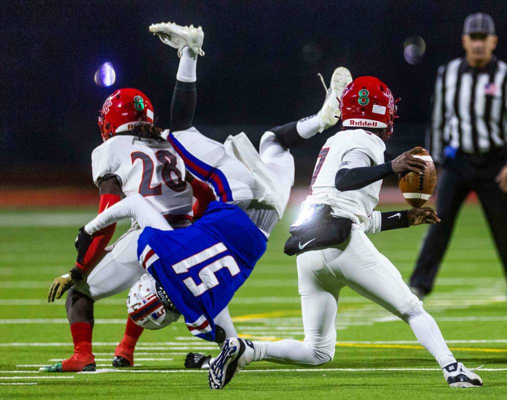 Arbor View QB Michael Kearns (7) looks to avoid Liberty OLB Emarion Jones flipping over RB Nyle ...