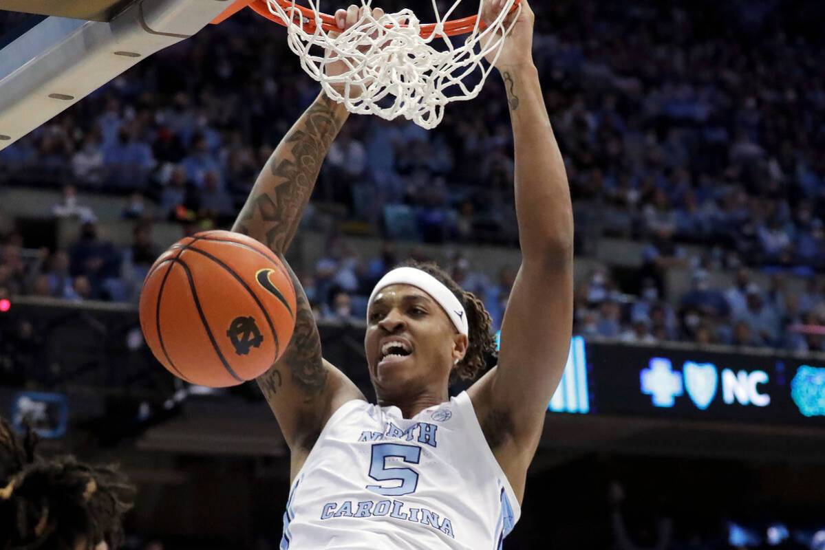 FILE - North Carolina forward Armando Bacot (5) dunks against Duke during the first half of an ...