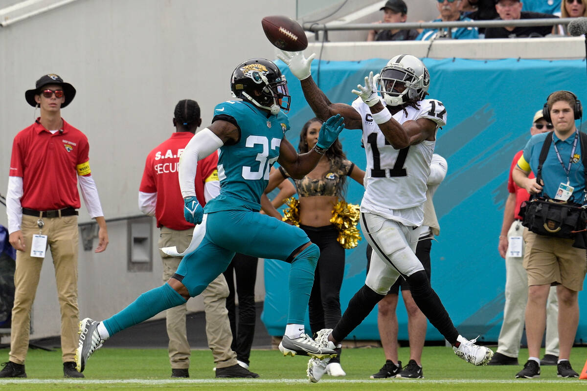 Las Vegas Raiders wide receiver Davante Adams (17) catches a touchdown pass ahead of Jacksonvil ...