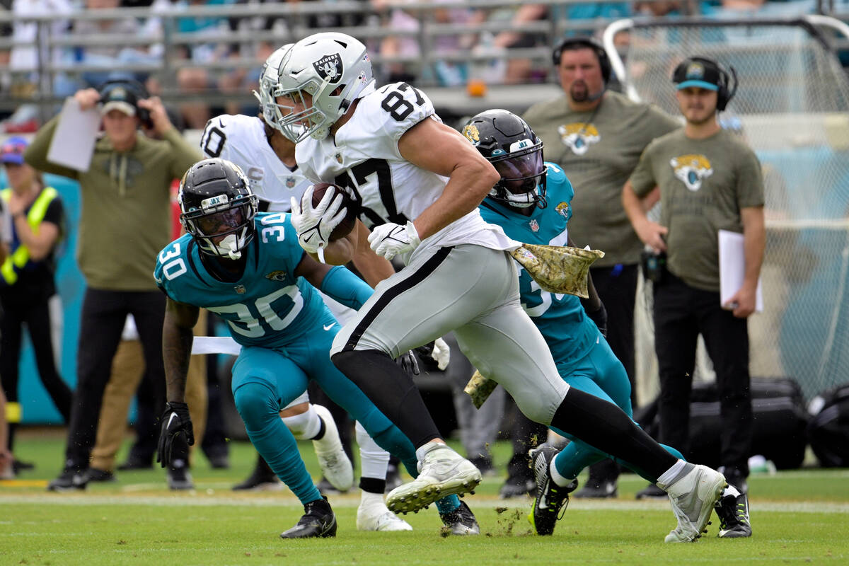 Las Vegas Raiders tight end Foster Moreau (87) tries to get past Jacksonville Jaguars cornerbac ...