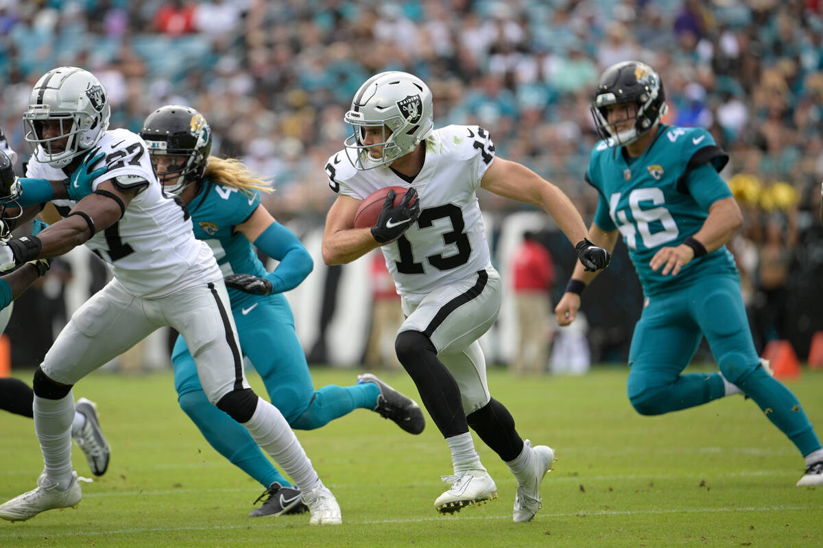 Las Vegas Raiders' Hunter Renfrow (13) returns a punt against the Jacksonville Jaguars in the f ...