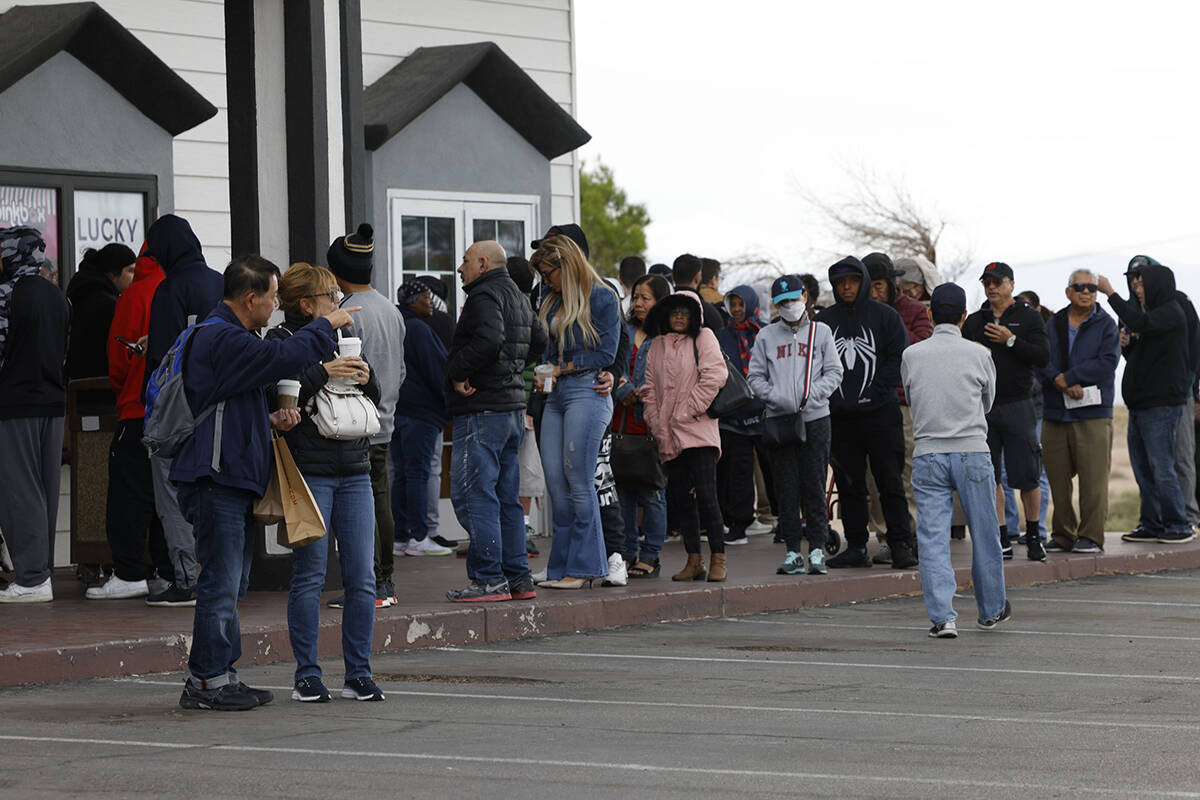 People wait in line to buy lottery tickets at the Lotto Store at Primm, just inside the Califor ...