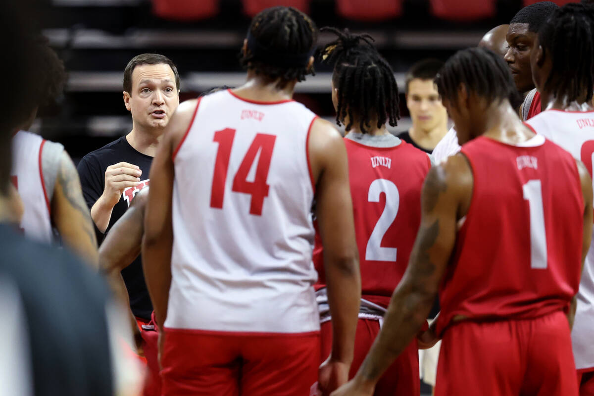 UNLV basketball coach Kevin Kruger interacts with his players during practice at Thomas & M ...