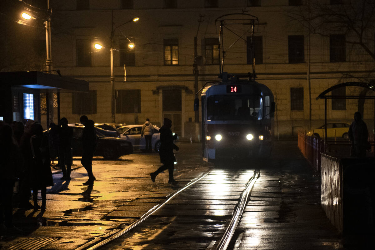 A tram arrives at a tram stop during a blackout in Kyiv, Ukraine, Sunday, Nov. 6, 2022. (AP Pho ...