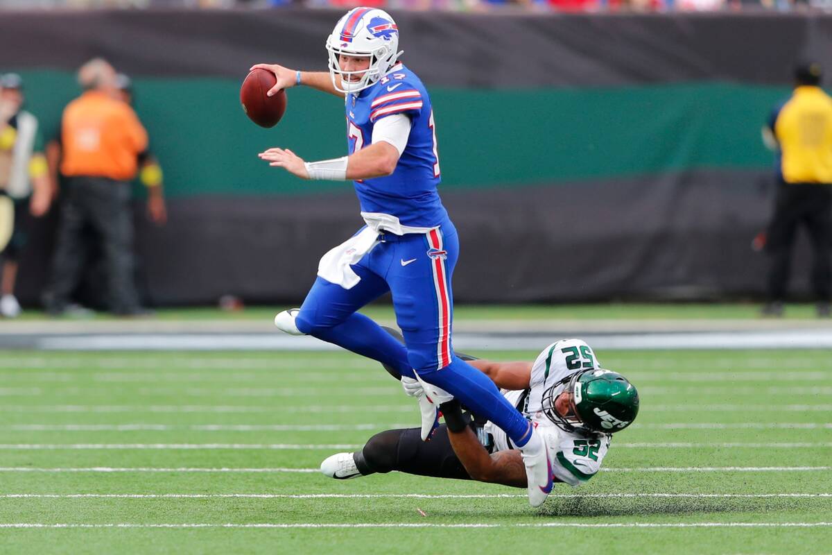New York Jets' Jermaine Johnson (52) tackles Buffalo Bills quarterback Josh Allen (17) during t ...