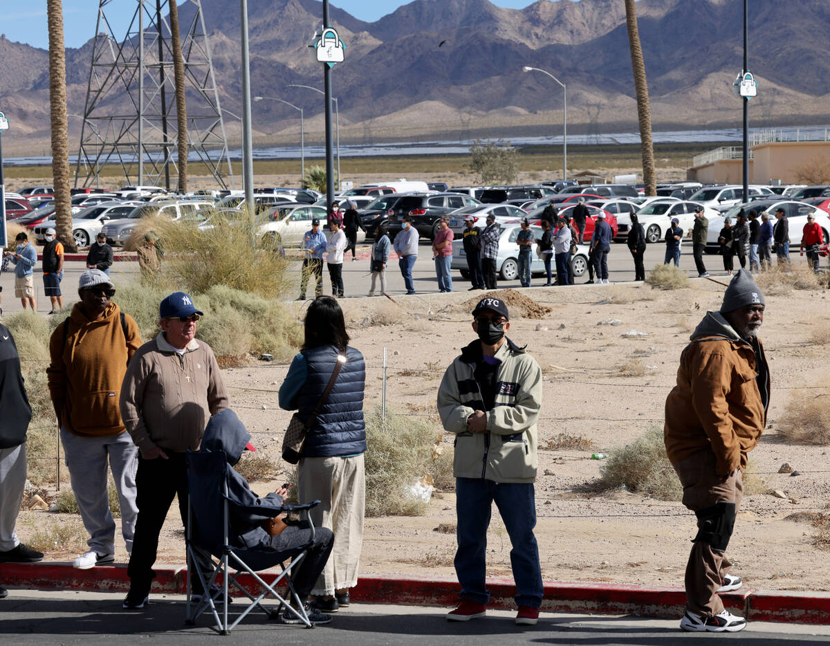 People wait in line to buy lottery tickets at the Lotto Store just across the Nevada/California ...