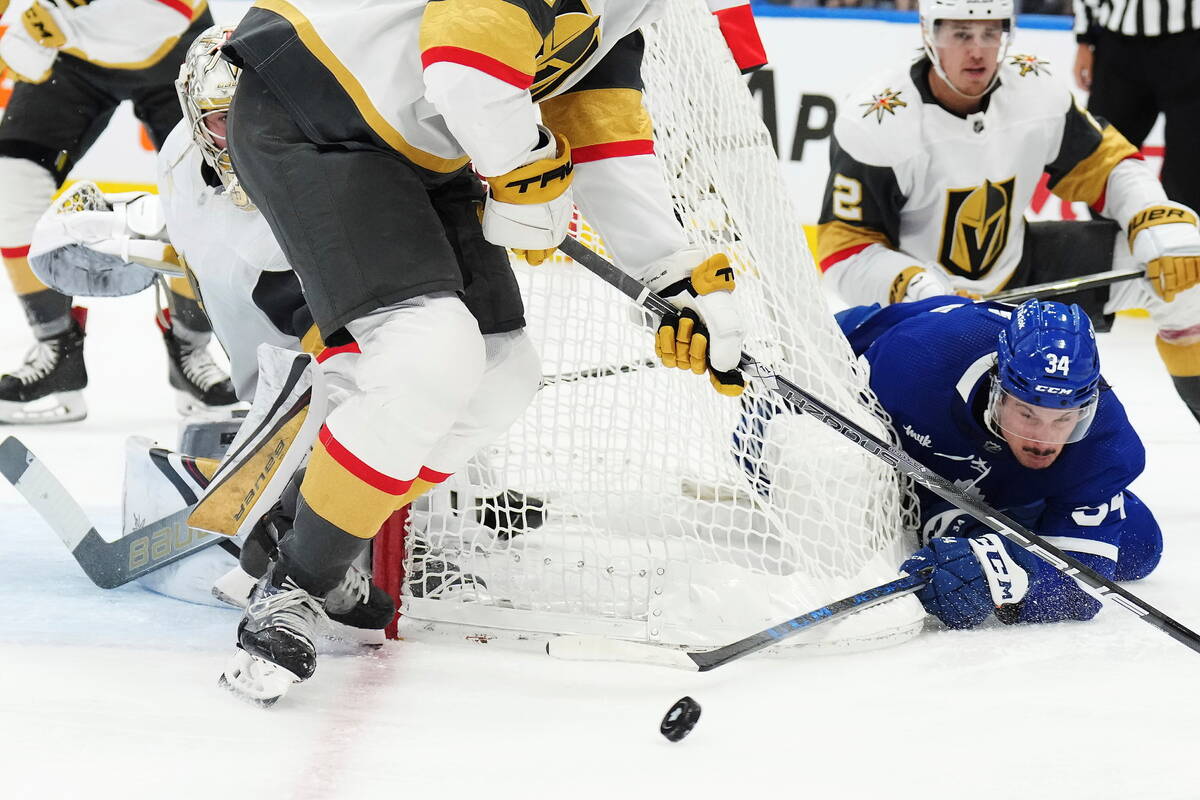 Toronto Maple Leafs forward Auston Matthews (34) tries a wrap around as Vegas Golden Knights de ...