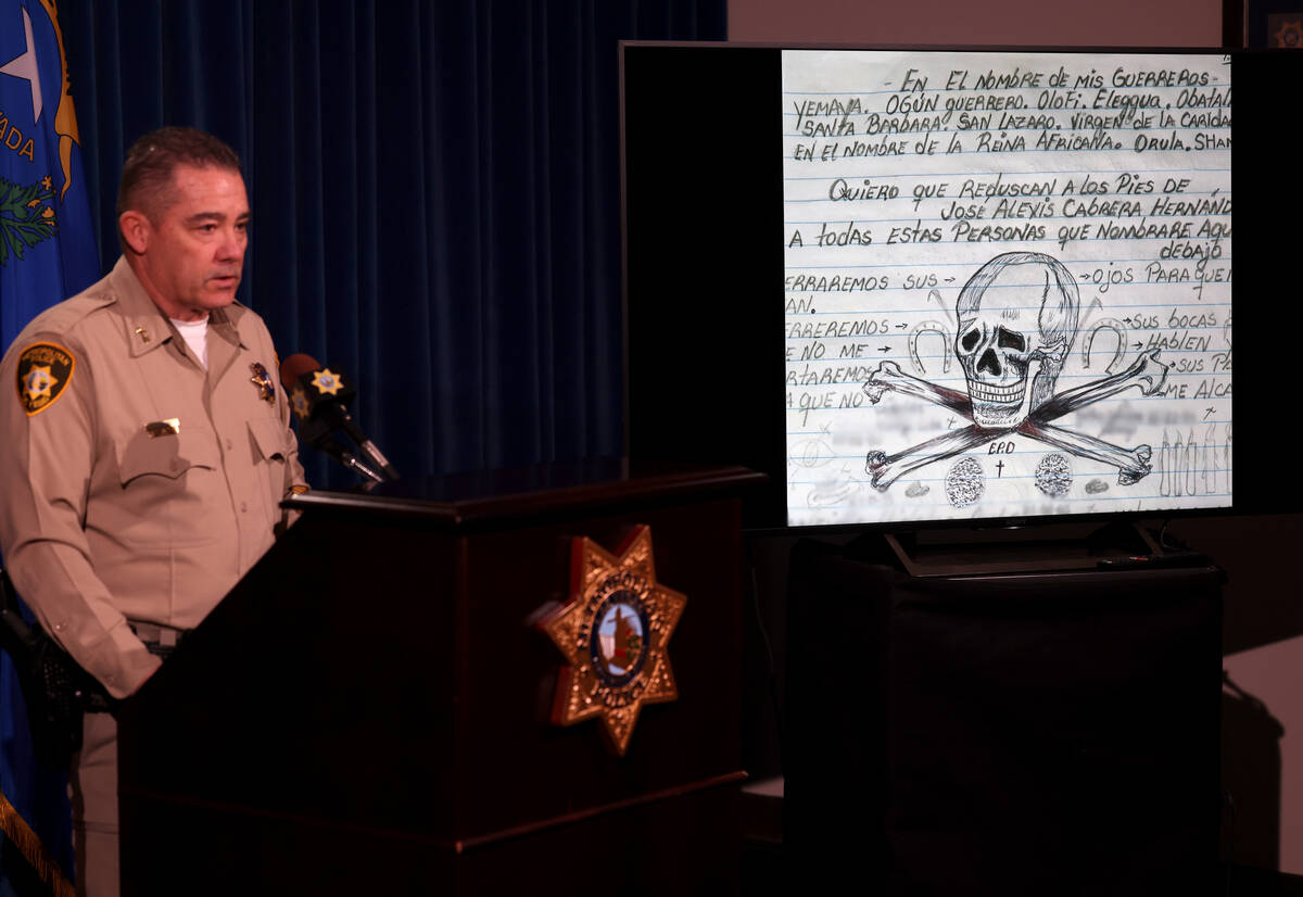 Assistant Sheriff Andrew Walsh shows a photo of a manifesto belonging to Jose Cabrera Hernandez ...